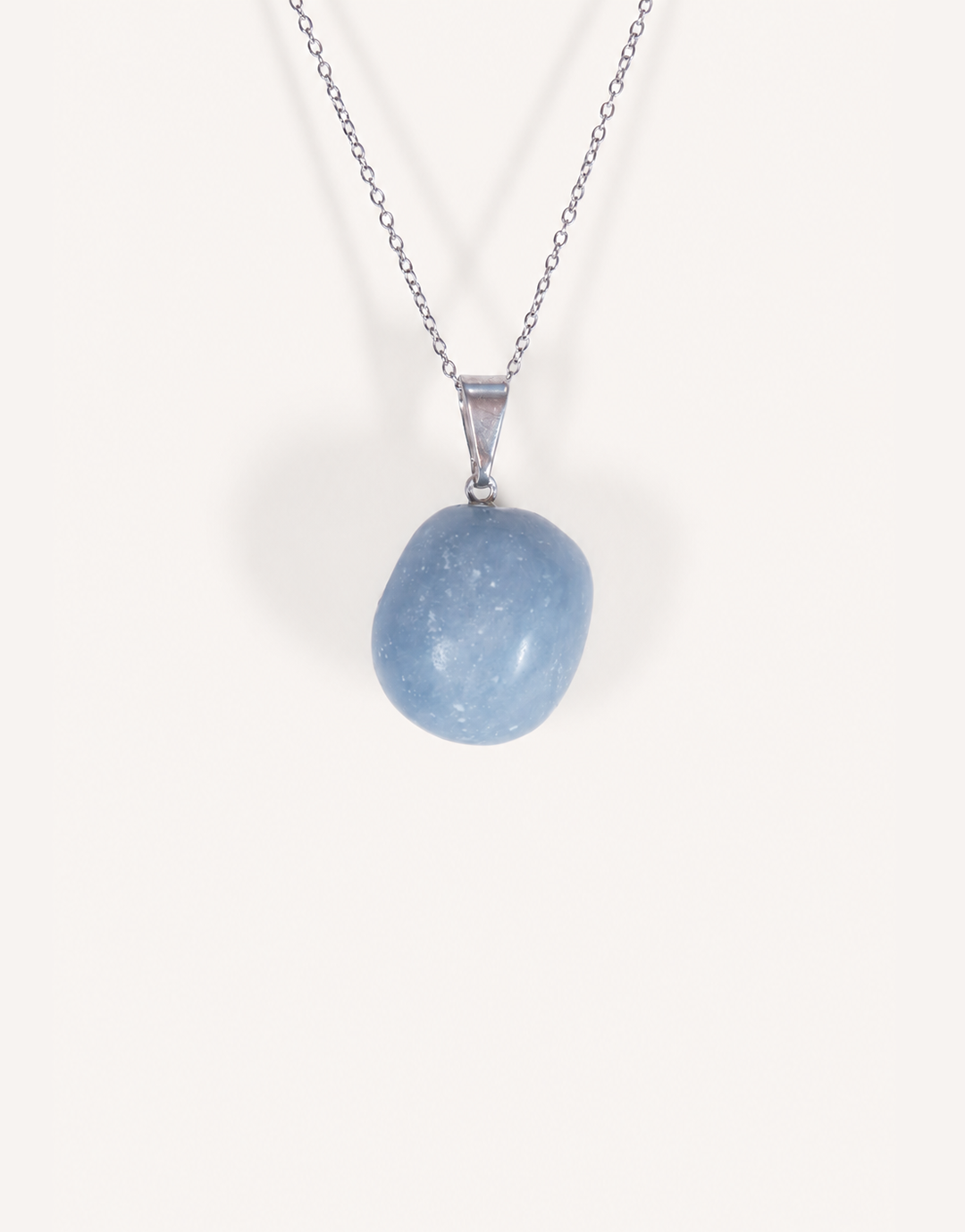 A Natural Angelite Pendant featuring a smooth powder-blue tumbled stone on an 18-inch stainless steel chain.