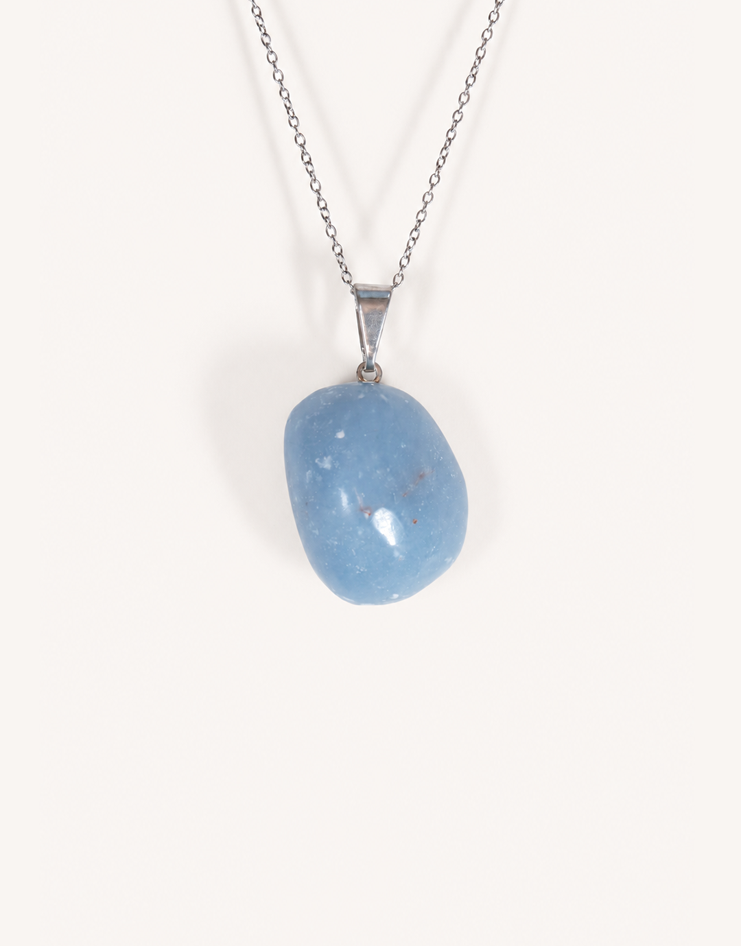 A Natural Angelite Pendant featuring a smooth powder-blue tumbled stone on an 18-inch stainless steel chain.