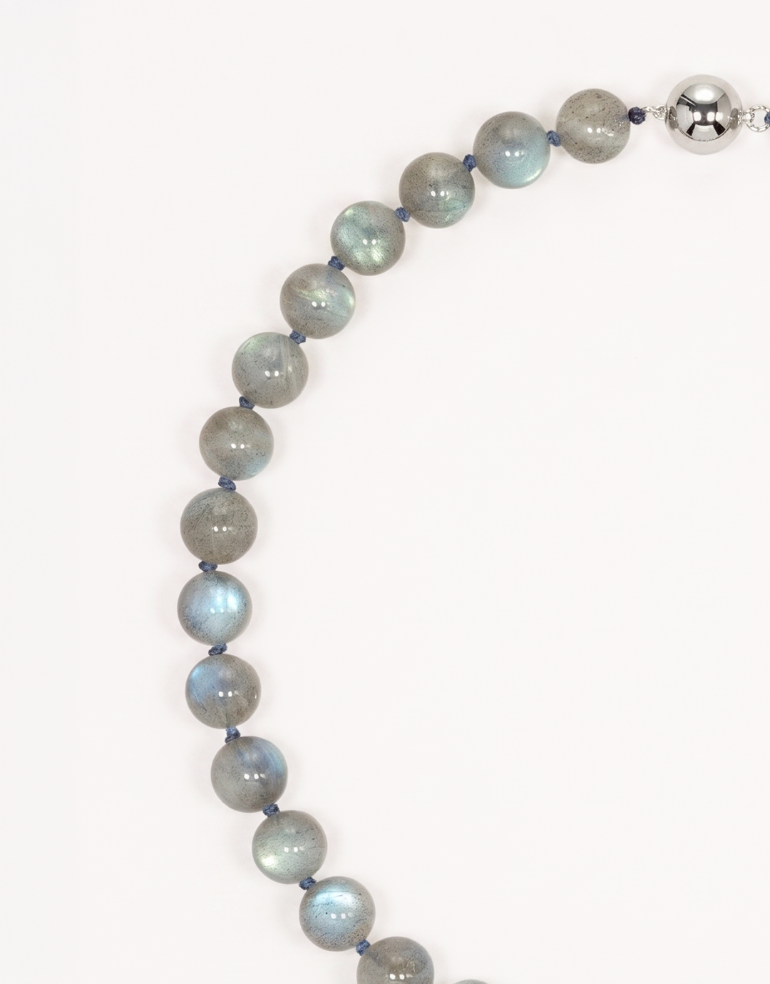 A 16-inch Natural Labradorite Necklace showcasing smooth 10mm charcoal-grey beads with iridescent blue and green labradorescence.