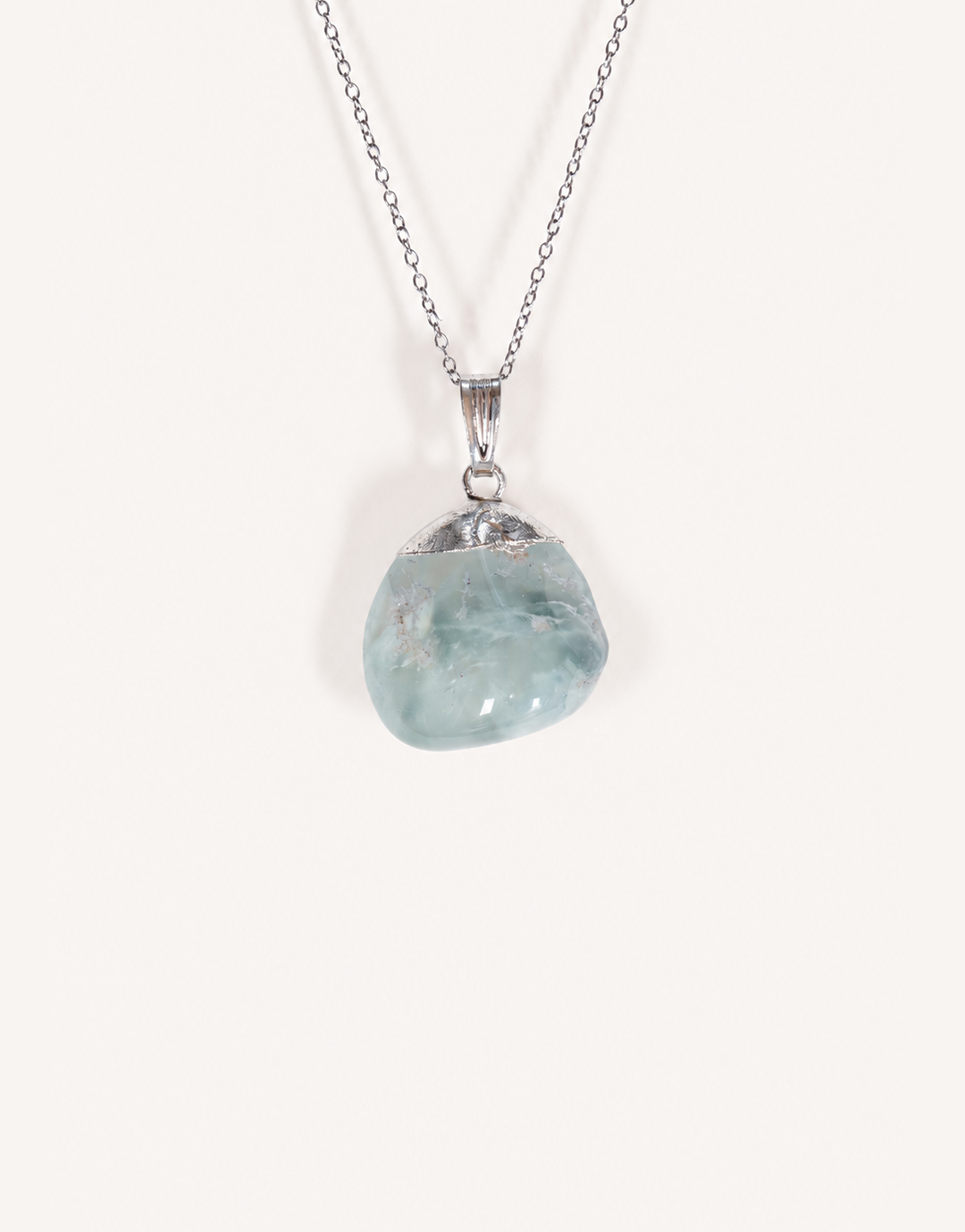 A Natural Prehnite Pendant featuring a smooth translucent light green tumbled stone on an 18-inch stainless steel chain.