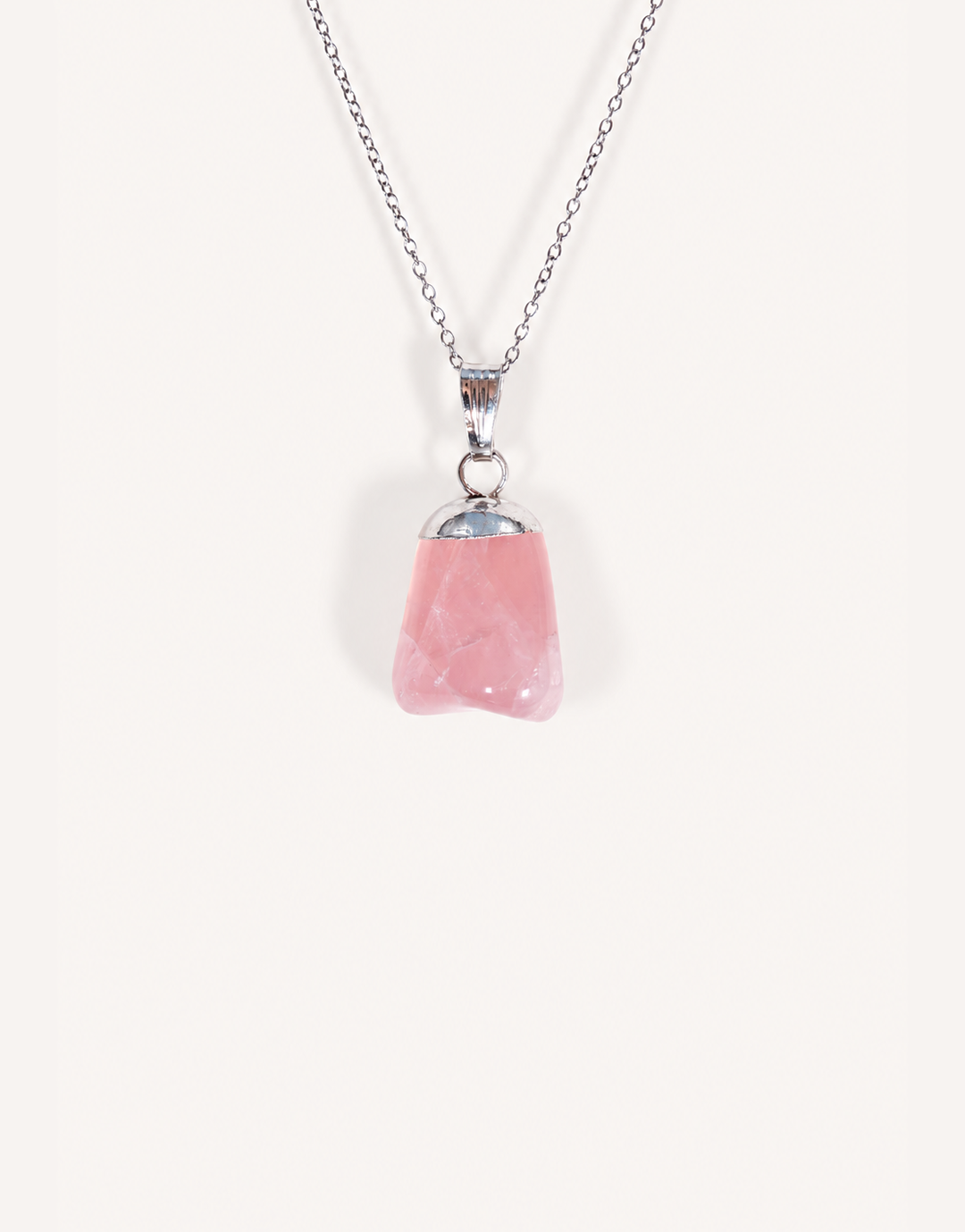 Natural polished rose quartz pendant in soft blush pink on a complimentary 18-inch stainless steel chain.