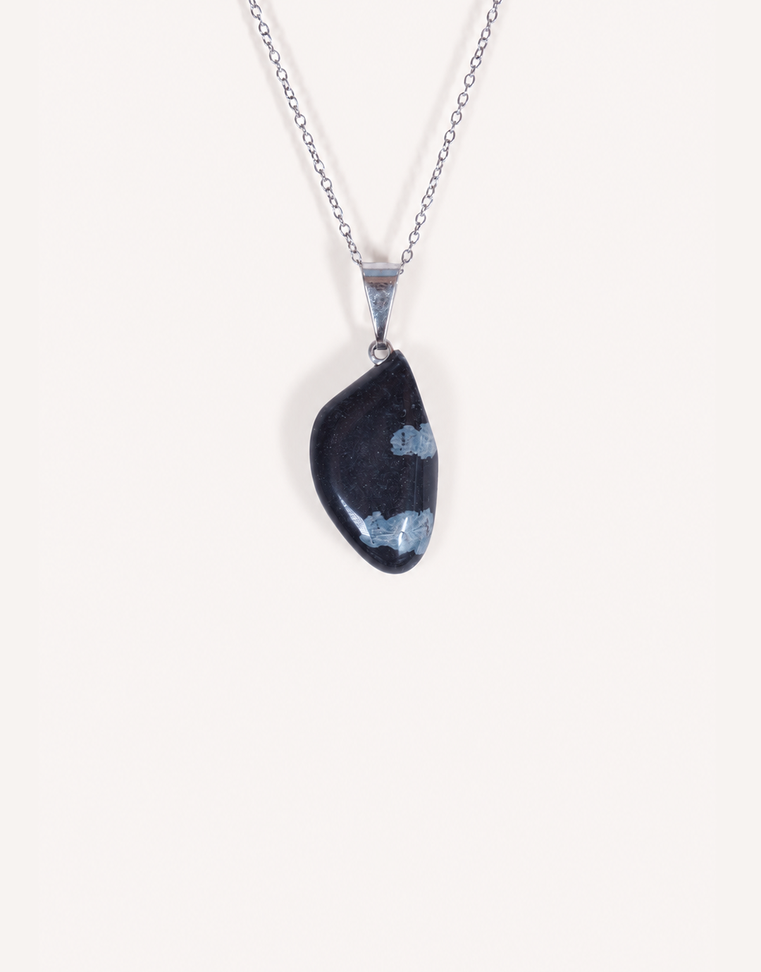 Natural polished snowflake obsidian pendant in jet black with white crystalline patterns on a complimentary 18-inch stainless steel chain.