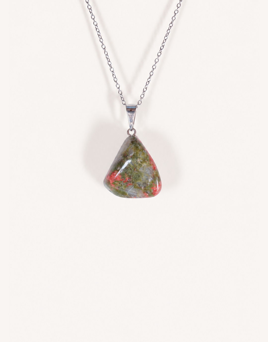 A Natural Unakite Pendant featuring a smooth green and coral-pink tumbled stone on an 18-inch stainless steel chain.