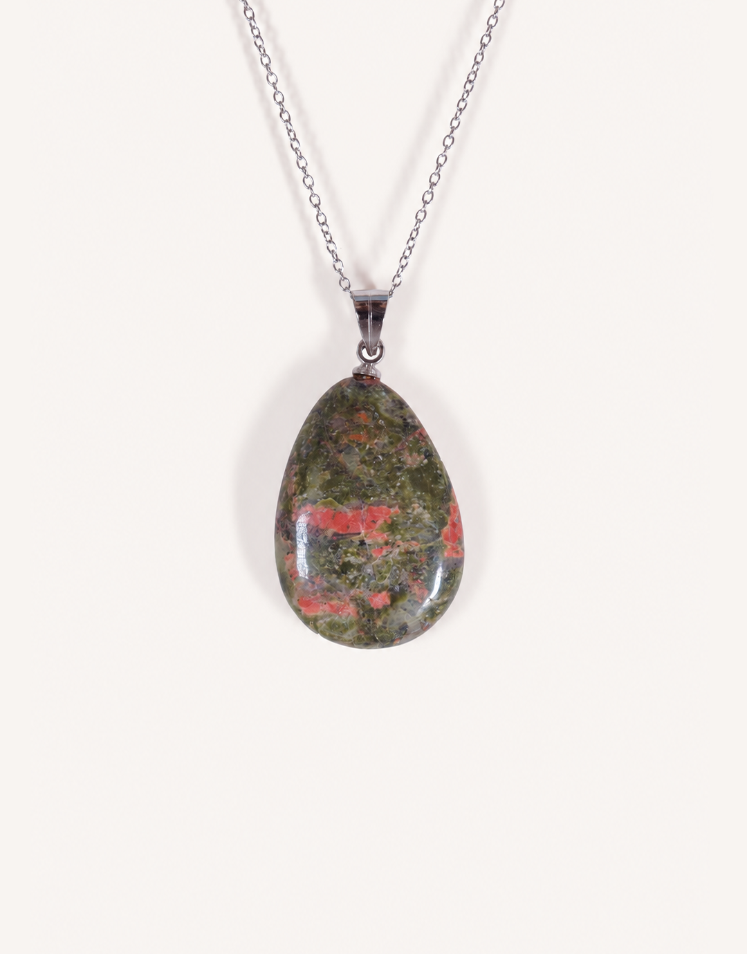 A Natural Unakite Pendant featuring a smooth green and coral-pink tumbled stone on an 18-inch stainless steel chain.