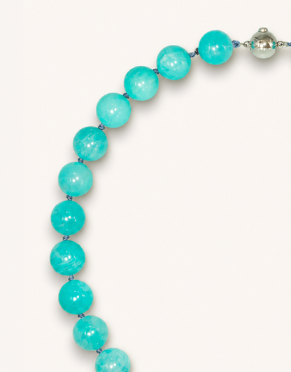A 16-inch Natural Amazonite Choker featuring polished 12mm sea-foam green and blue beads with unique natural striations.