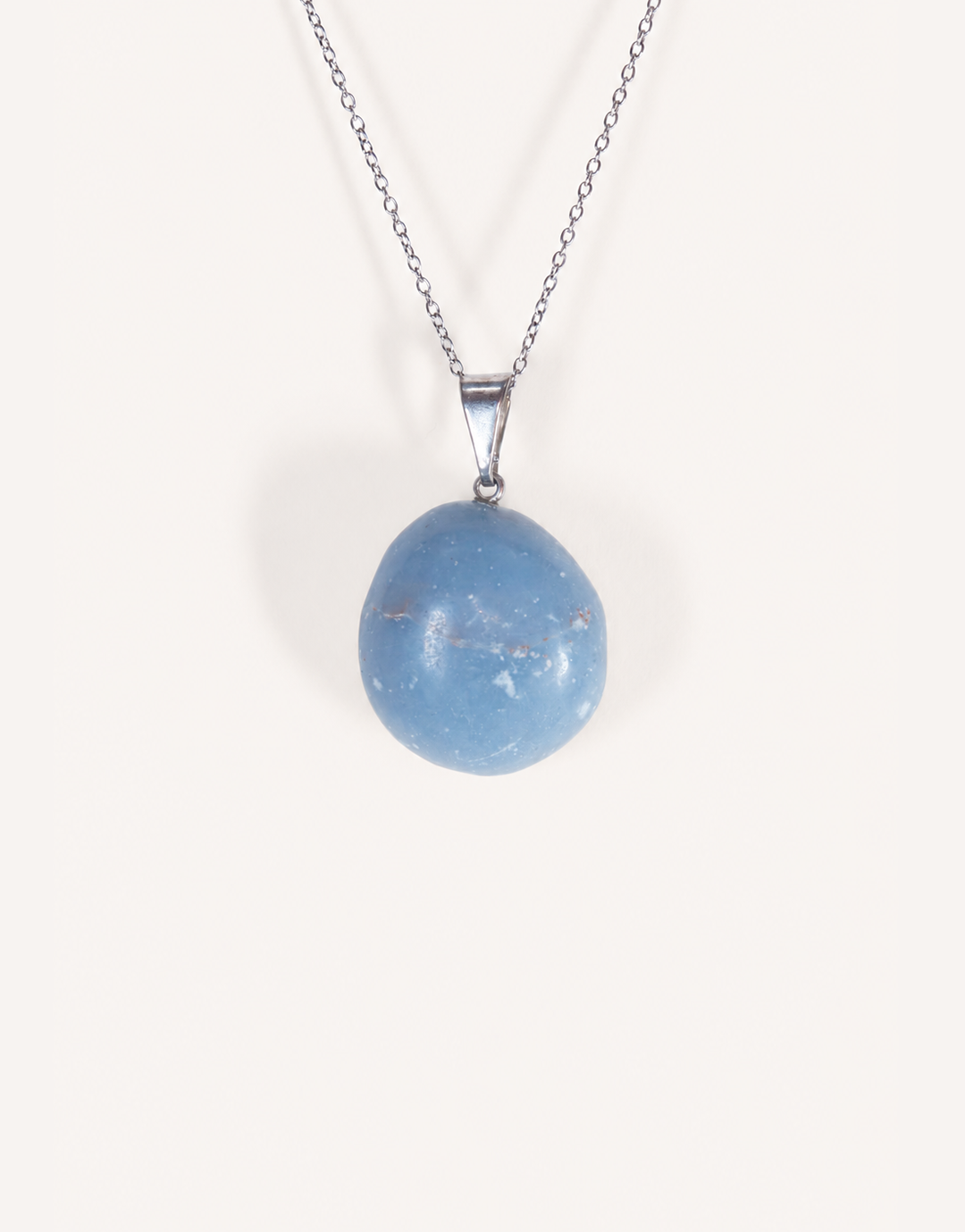 A Natural Angelite Pendant featuring a smooth powder-blue tumbled stone on an 18-inch stainless steel chain.