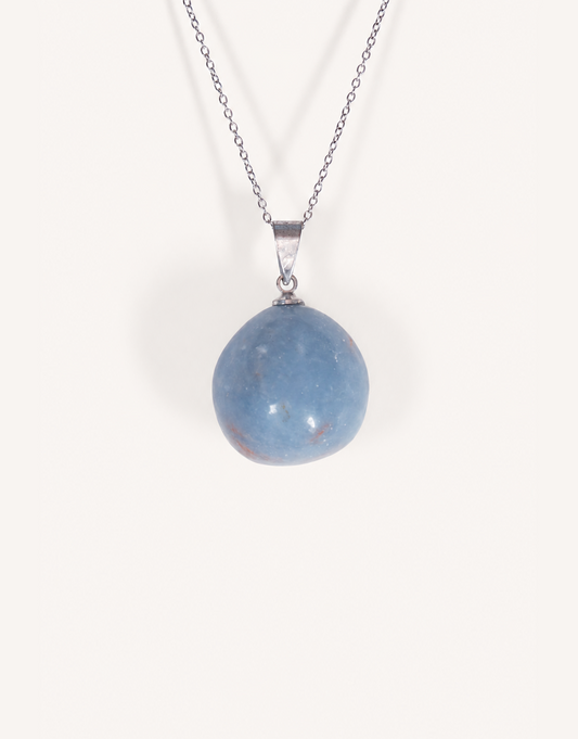 A Natural Angelite Pendant featuring a smooth powder-blue tumbled stone on an 18-inch stainless steel chain.
