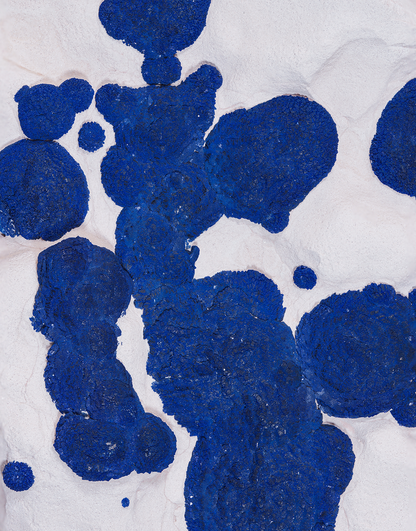 An Azurite on Kaolinite mineral specimen from the Malbunka Mine, Australia, featuring vivid blue azurite clusters on white matrix, mounted on a clear stand.
