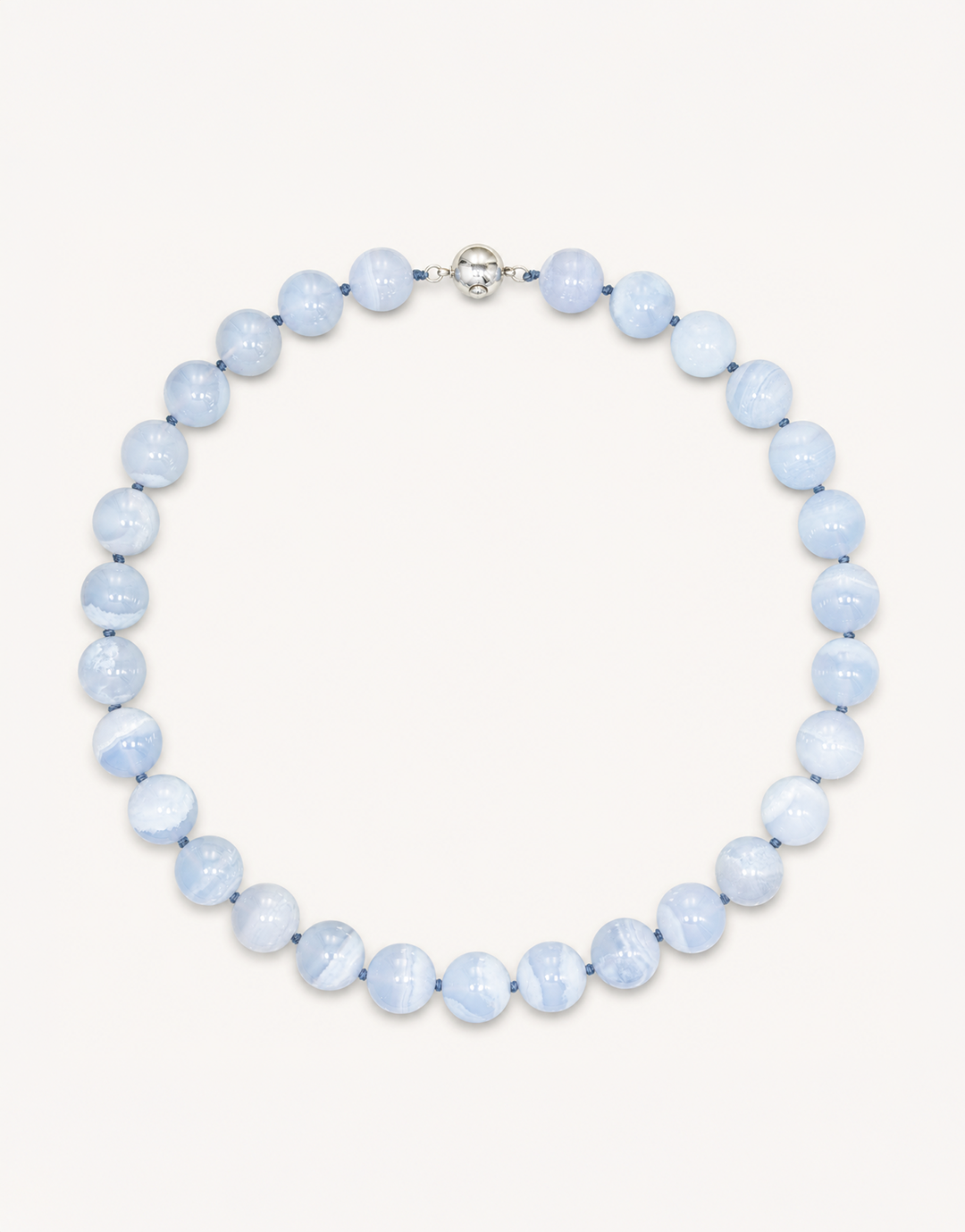 A 16-inch Natural Blue Lace Agate Necklace featuring smooth 12mm light blue beads with delicate white striped patterns.