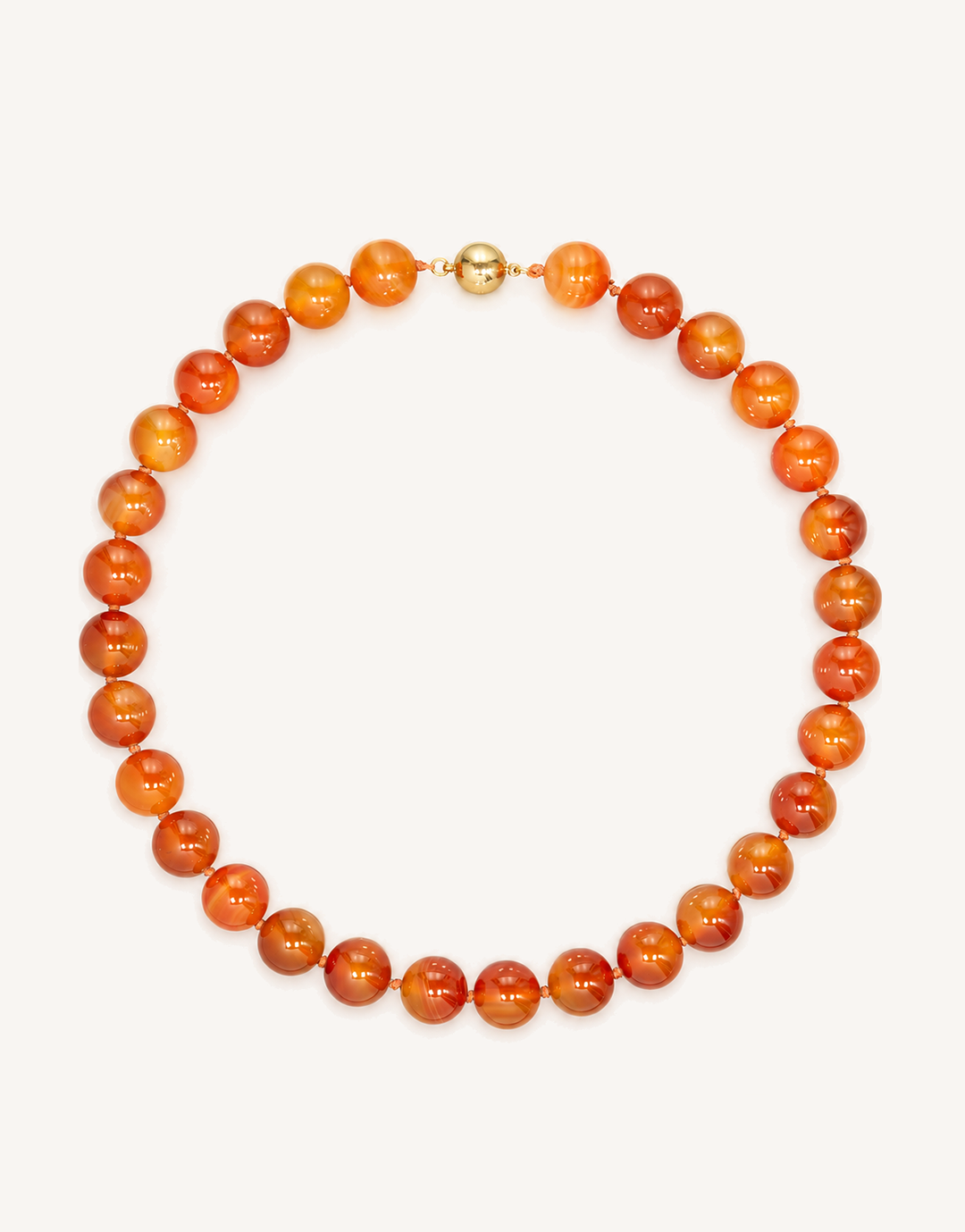 A 16-inch Natural Carnelian Necklace crafted with smooth 12mm beads in glowing shades of burnt orange, amber, and deep crimson.