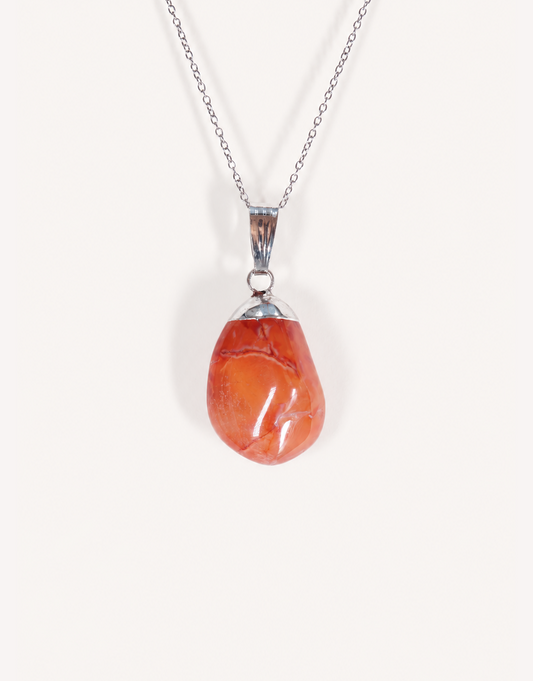 A Natural Carnelian Pendant featuring a smooth, polished orange tumbled stone on an 18-inch stainless steel chain.
