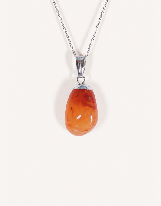 A Natural Carnelian Pendant featuring a smooth, polished orange tumbled stone on an 18-inch stainless steel chain.