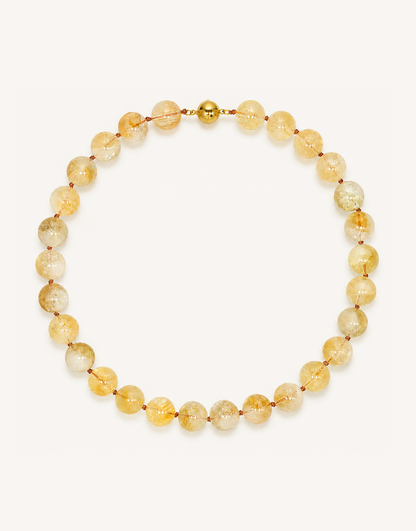 A 16-inch Natural Citrine Necklace crafted with smooth 12mm translucent beads in shades of warm amber, yellow, and honey.