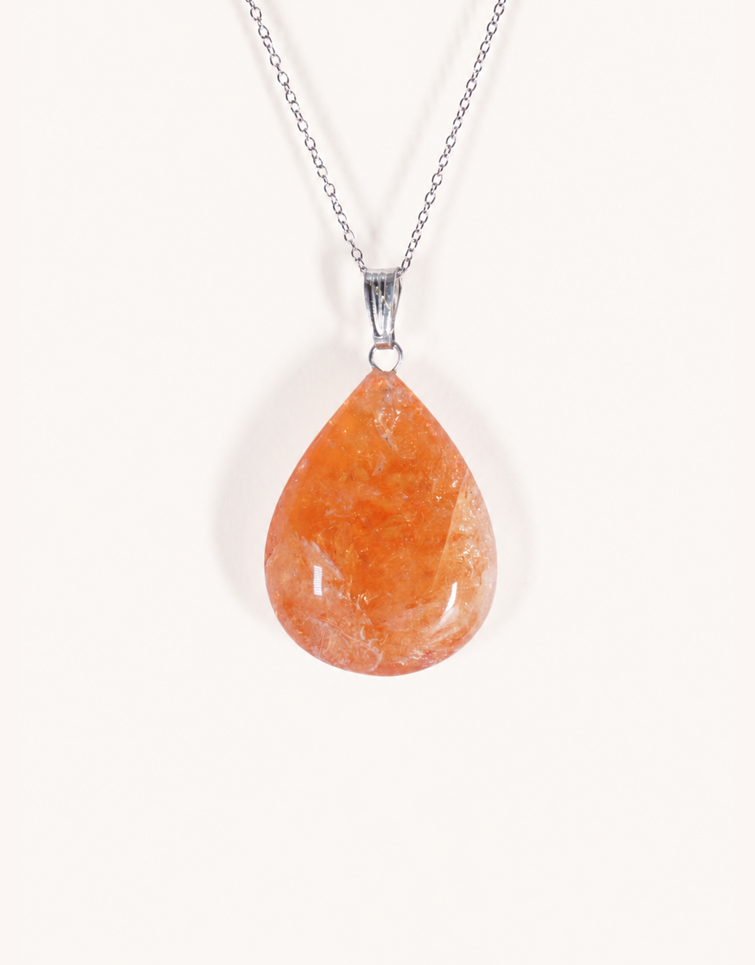 A Natural Heat-Treated Citrine Pendant displaying rich golden amber hues on an 18-inch stainless steel chain.