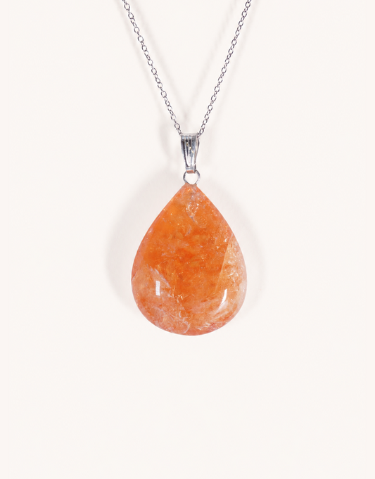 A Natural Heat-Treated Citrine Pendant displaying rich golden amber hues on an 18-inch stainless steel chain.