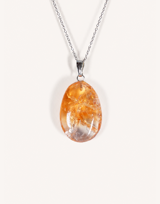 A Natural Heat-Treated Citrine Pendant displaying rich golden amber hues on an 18-inch stainless steel chain.