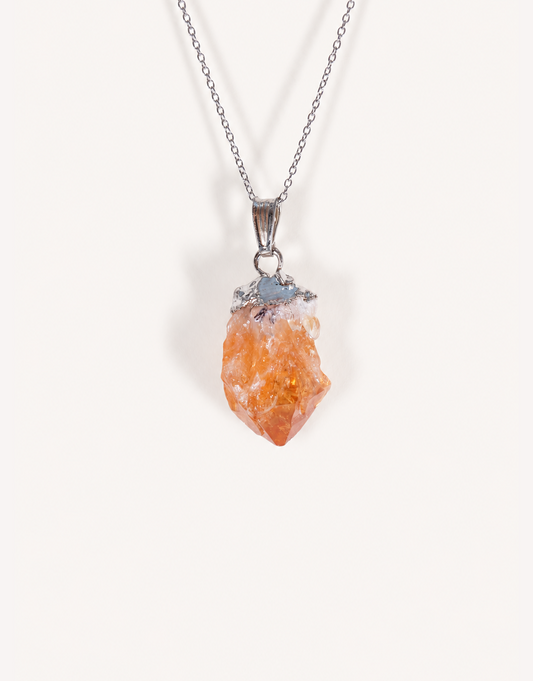 A Natural Raw Citrine Point Pendant showcasing a rough amber-orange and white crystal point on an 18-inch stainless steel chain.