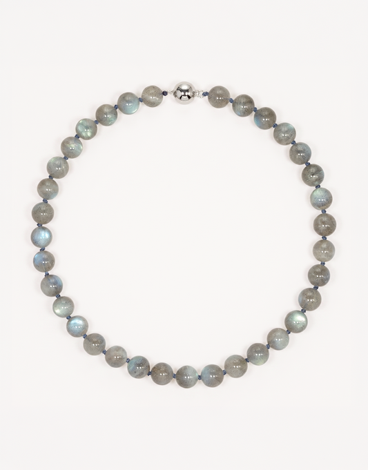 A 16-inch Natural Labradorite Necklace showcasing smooth 10mm charcoal-grey beads with iridescent blue and green labradorescence.