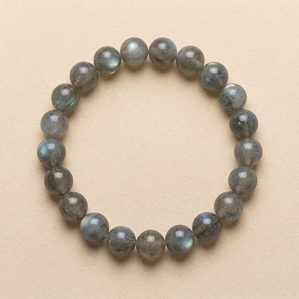 Labradorite beaded bracelet on a beige background