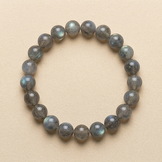 Labradorite beaded bracelet on a beige background