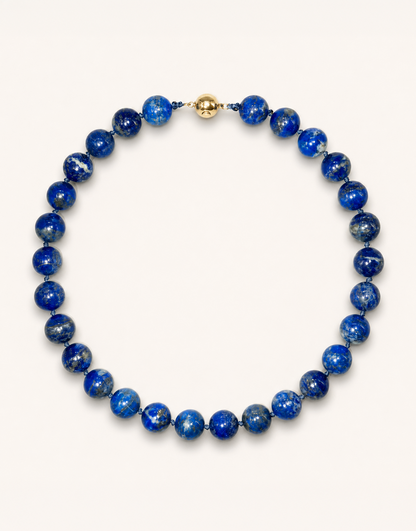 A 16-inch Natural Lapis Lazuli Choker displaying rich royal blue 12mm beads with golden pyrite flecks.
