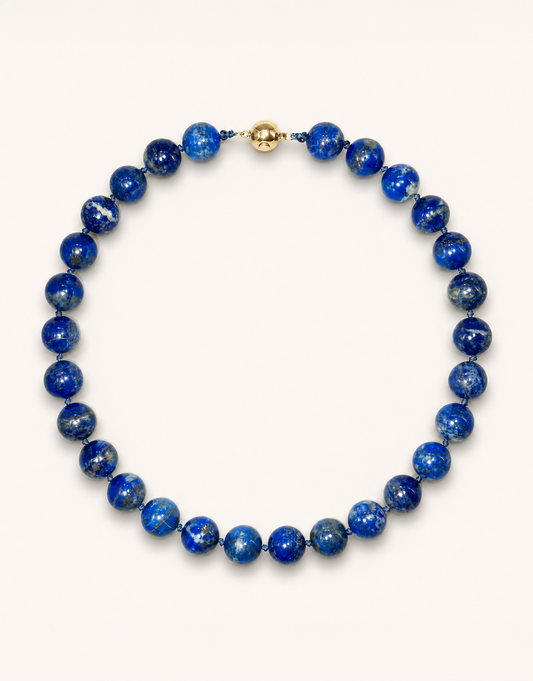 A 16-inch Natural Lapis Lazuli Choker displaying rich royal blue 12mm beads with golden pyrite flecks.