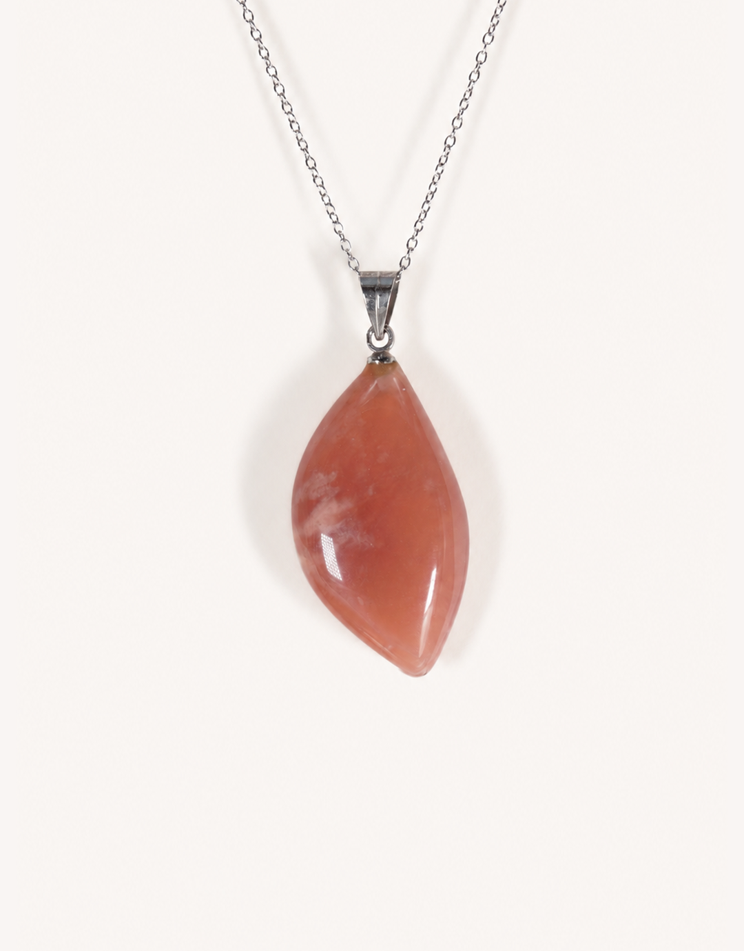 A Natural Peach Moonstone Pendant featuring smooth apricot and dusty-rose tones with a soft sheen on an 18-inch stainless steel chain.