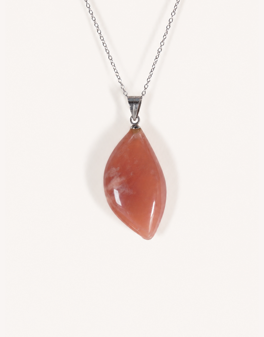 A Natural Peach Moonstone Pendant featuring smooth apricot and dusty-rose tones with a soft sheen on an 18-inch stainless steel chain.