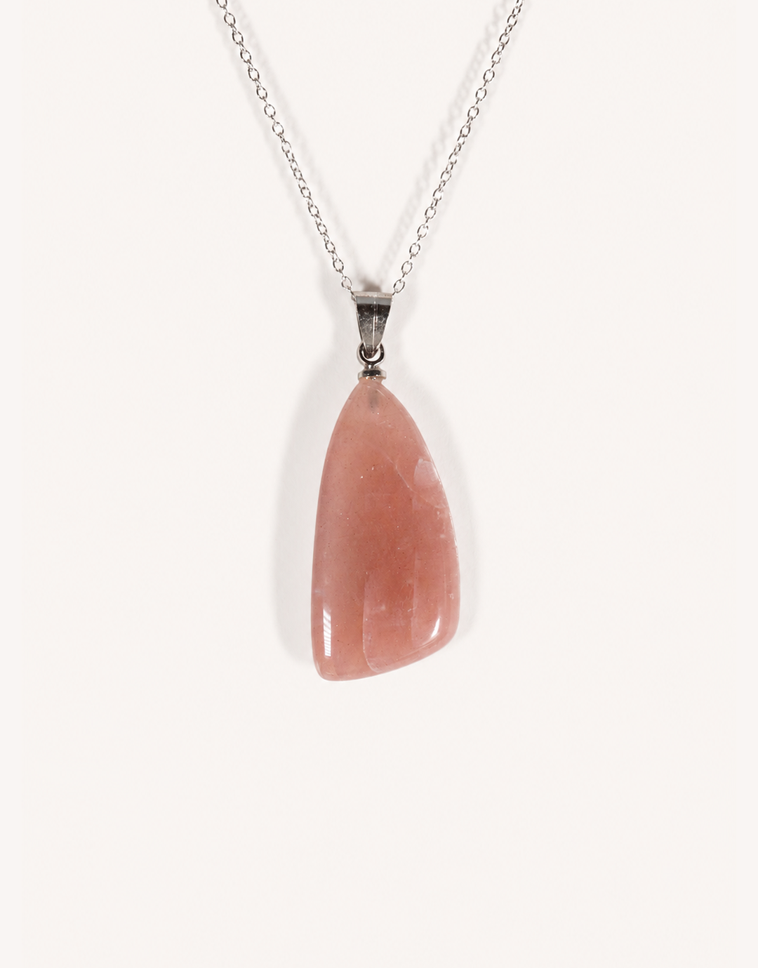 A Natural Peach Moonstone Pendant featuring smooth apricot and dusty-rose tones with a soft sheen on an 18-inch stainless steel chain.