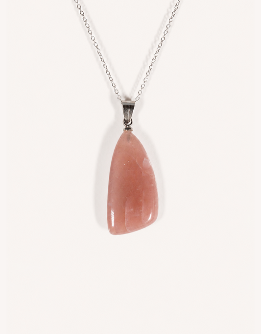 A Natural Peach Moonstone Pendant featuring smooth apricot and dusty-rose tones with a soft sheen on an 18-inch stainless steel chain.