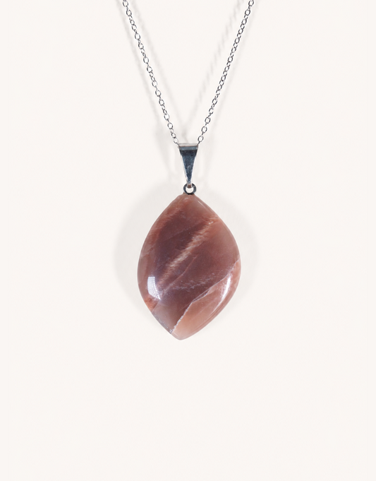 A Natural Peach Moonstone Pendant featuring smooth apricot and dusty-rose tones with a soft sheen on an 18-inch stainless steel chain.