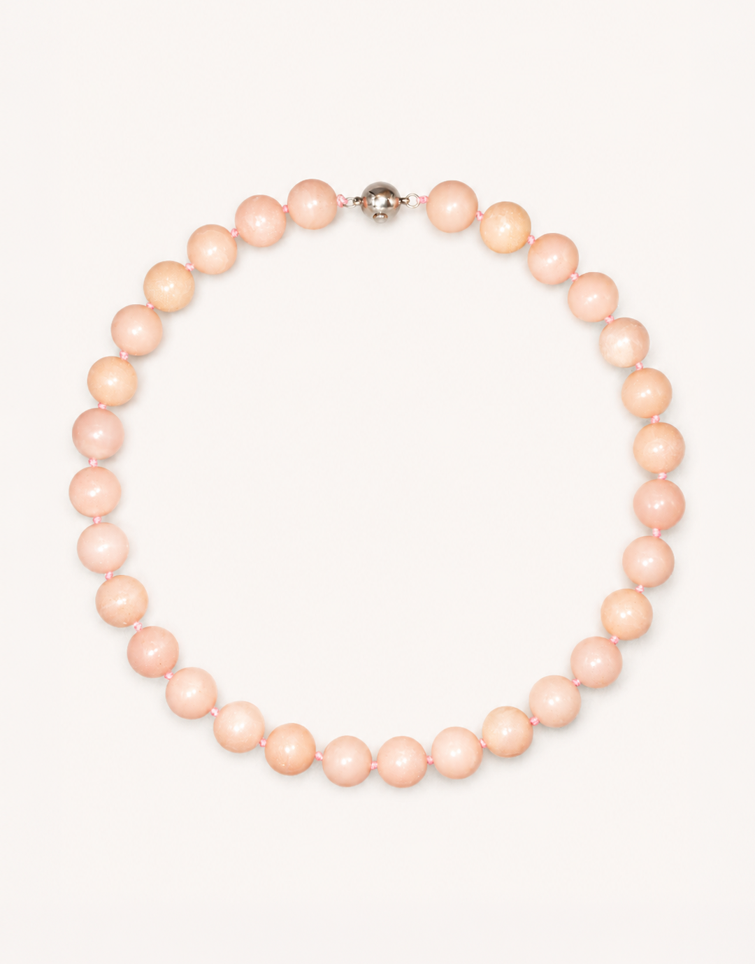 A 16-inch Natural Pink Opal Choker crafted with smooth 12mm beads in shades of pastel pink and ivory.