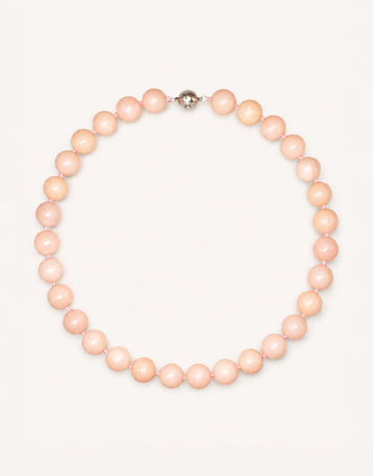 A 16-inch Natural Pink Opal Choker crafted with smooth 12mm beads in shades of pastel pink and ivory.