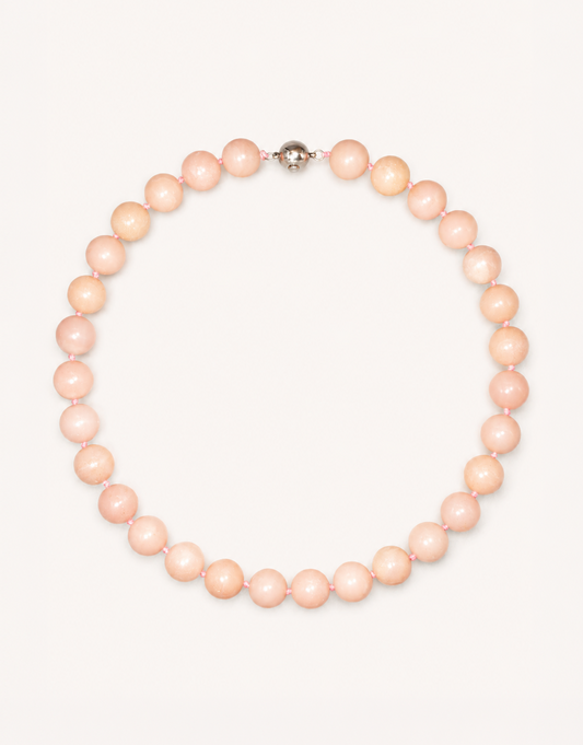 A 16-inch Natural Pink Opal Choker crafted with smooth 12mm beads in shades of pastel pink and ivory.