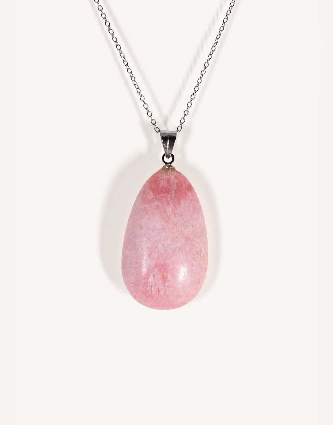 A Natural Pink Opal Pendant featuring smooth pastel pink and ivory hues on an 18-inch stainless steel chain.