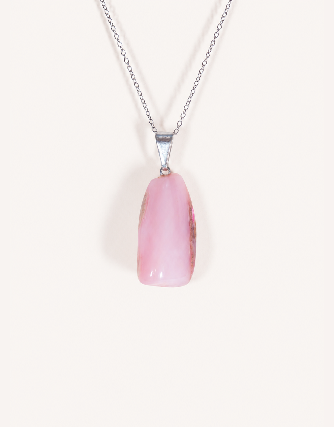 A Natural Pink Opal Pendant featuring a smooth pastel pink tumbled stone on an 18-inch stainless steel chain.