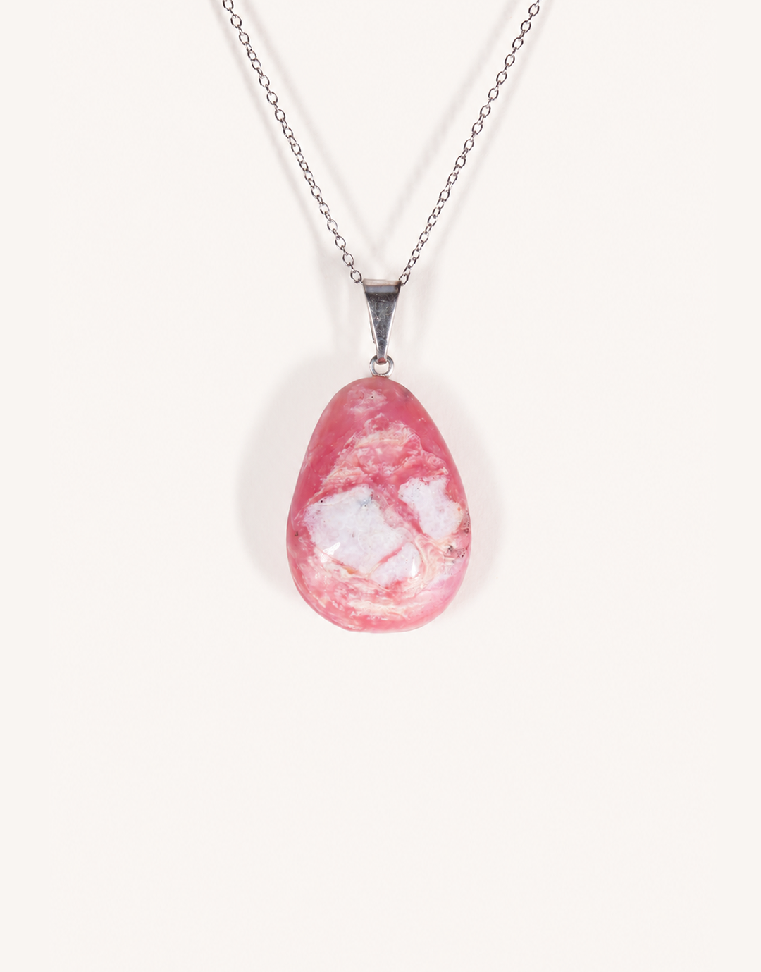A Natural Pink Opal Pendant featuring smooth pastel pink and ivory hues on an 18-inch stainless steel chain.