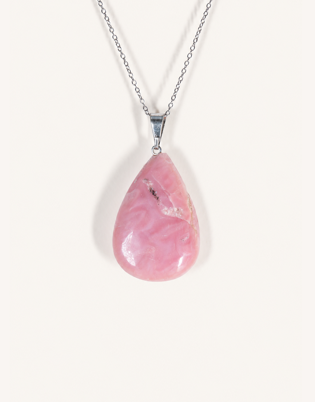 A Natural Pink Opal Pendant featuring smooth pastel pink and ivory hues on an 18-inch stainless steel chain.