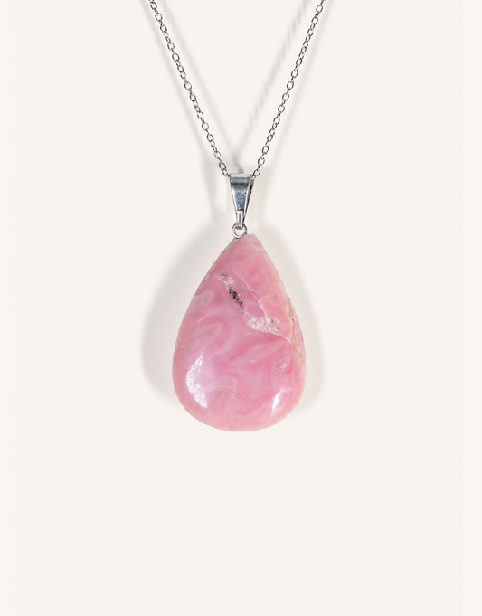A Natural Pink Opal Pendant featuring smooth pastel pink and ivory hues on an 18-inch stainless steel chain.