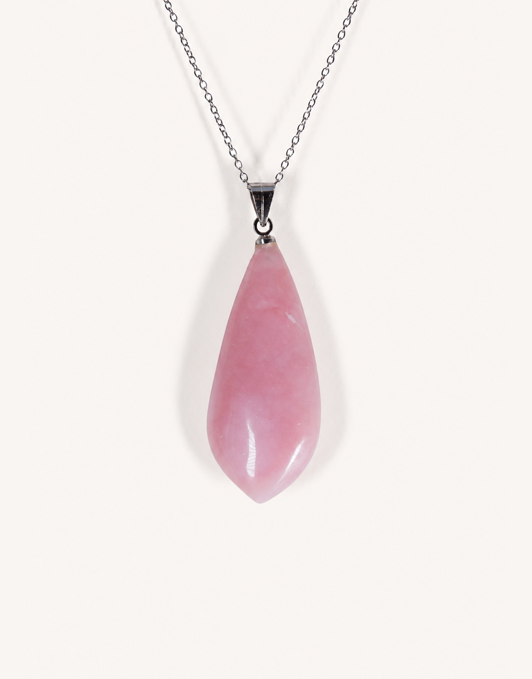 A Natural Pink Opal Pendant featuring smooth pastel pink and ivory hues on an 18-inch stainless steel chain.