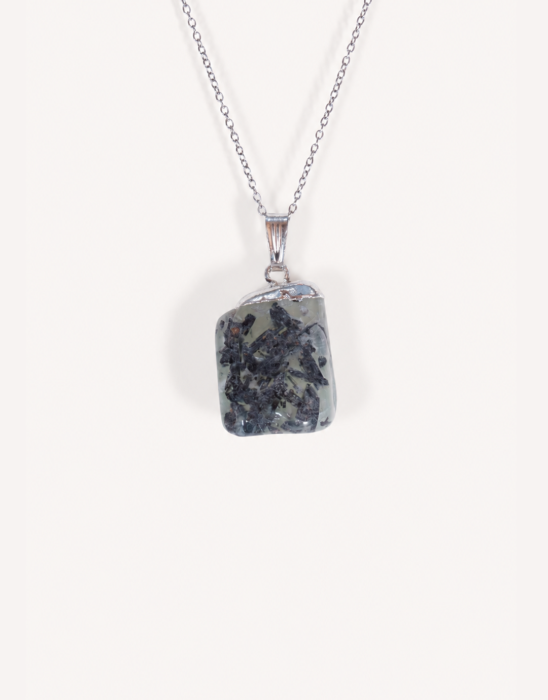 A Natural Prehnite Pendant featuring a smooth translucent light green tumbled stone on an 18-inch stainless steel chain.