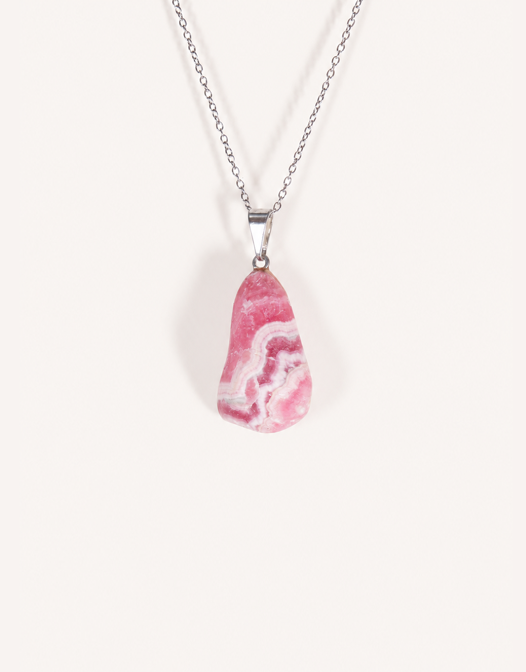 A Natural Rhodochrosite Pendant featuring a smooth pink stone with white banded ribbons on an 18-inch stainless steel chain.