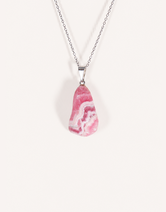 A Natural Rhodochrosite Pendant featuring a smooth pink stone with white banded ribbons on an 18-inch stainless steel chain.