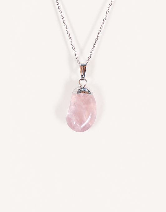 Natural polished rose quartz pendant in soft blush pink on a complimentary 18-inch stainless steel chain.