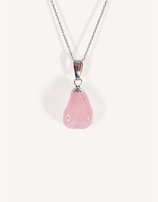 Natural polished rose quartz pendant in soft blush pink on a complimentary 18-inch stainless steel chain.
