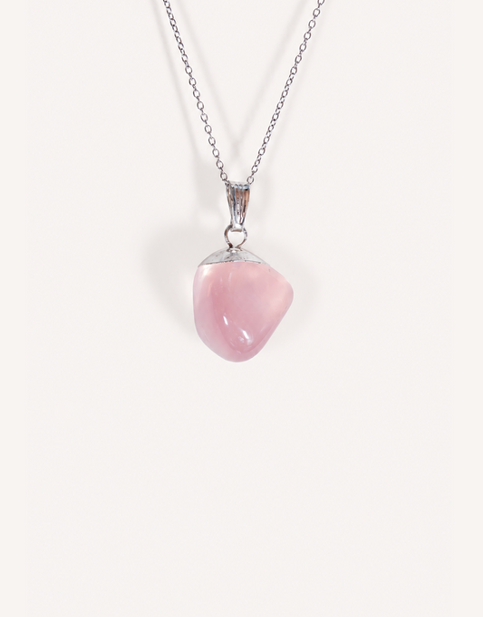 Natural polished rose quartz pendant in soft blush pink on a complimentary 18-inch stainless steel chain.