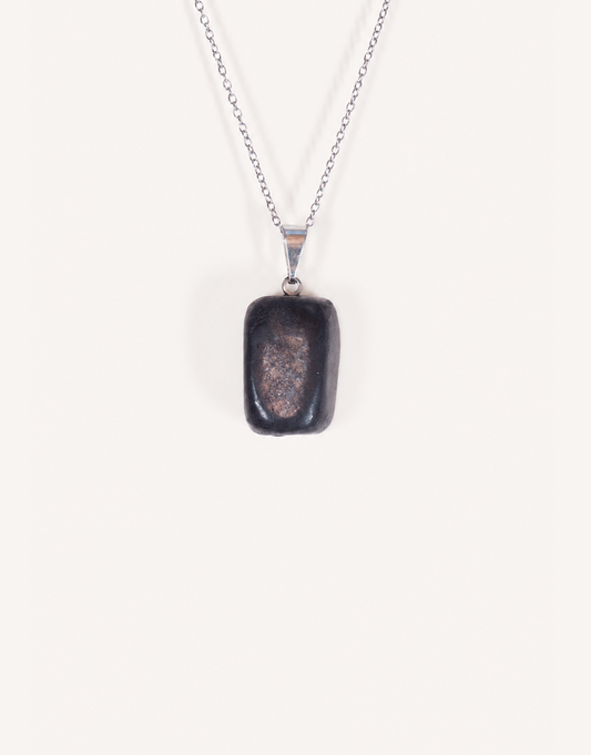 A Natural Shungite Pendant featuring a smooth graphite-black tumbled stone on an 18-inch stainless steel chain.