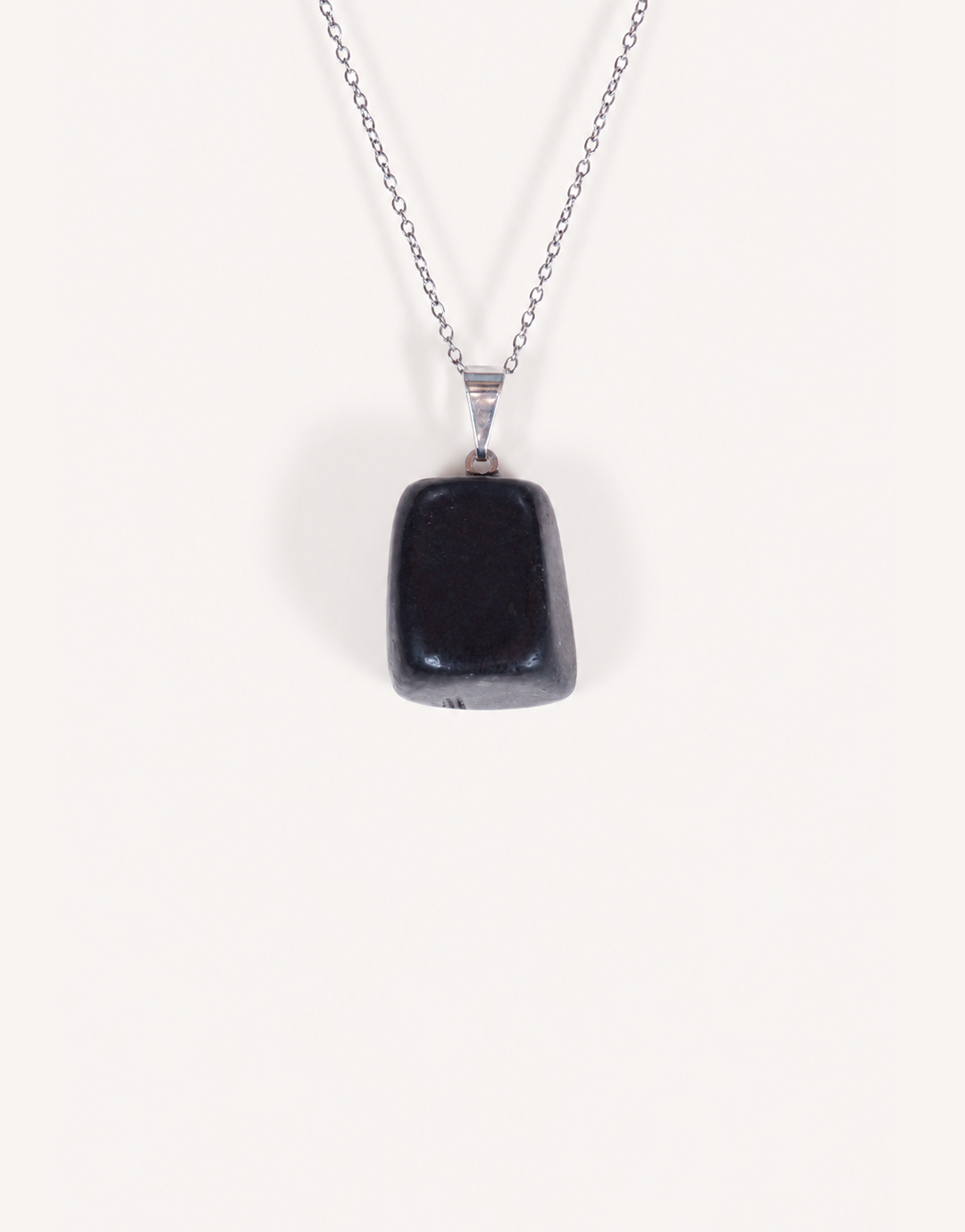 A Natural Shungite Pendant featuring a smooth graphite-black tumbled stone on an 18-inch stainless steel chain.