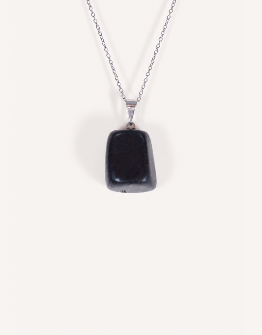 A Natural Shungite Pendant featuring a smooth graphite-black tumbled stone on an 18-inch stainless steel chain.