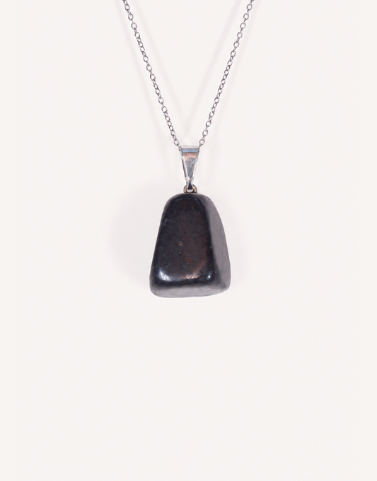 A Natural Shungite Pendant featuring a smooth graphite-black tumbled stone on an 18-inch stainless steel chain.